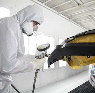 Collision Center Technician Painting a Vehicle | Steet Toyota of Yorkville in Yorkville NY