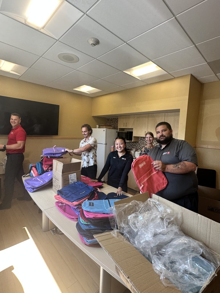 Steet Toyota employees packing backpacks for the 2nd Annual School Supplies Drive!