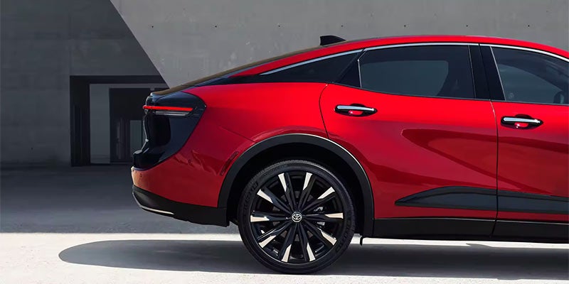 Image of the back end of a red Toyota Crown Sedan