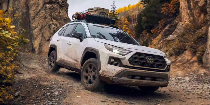 a 2024 Toyota RAV4 off-roading down a mountain