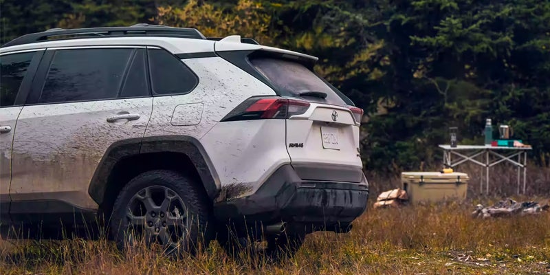 Image of a 2024 Toyota RAV4 parked by a campsite