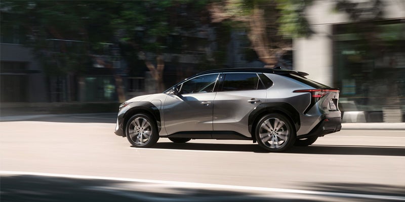 Image of a white Toyota bZ4X parked on a street